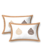 Two white pillow covers with a caramel beige frame and beige & brown damask buta motifs