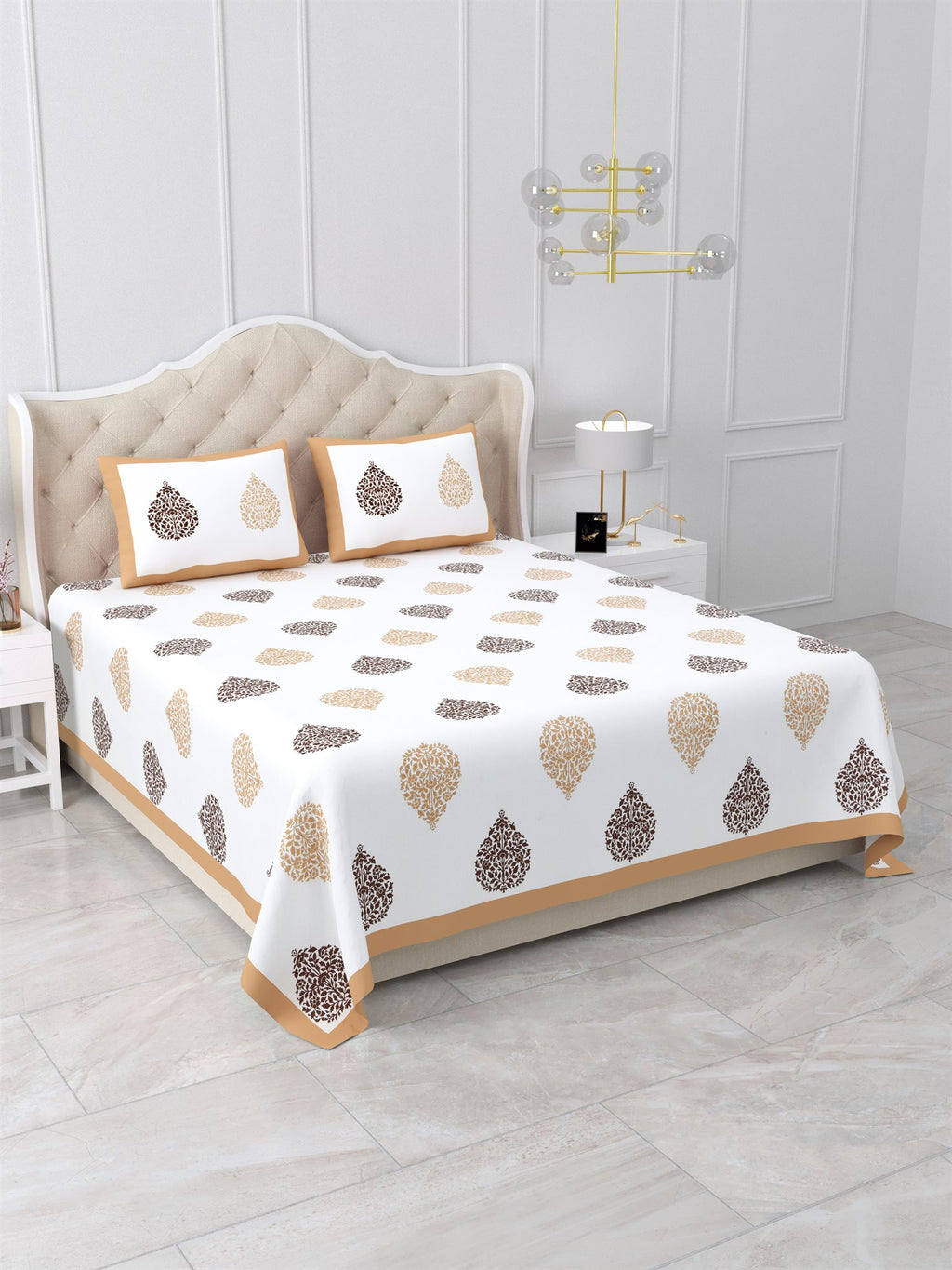 Angled view of the beige & brown damask buta bedsheet on a bed with 2 pillow covers