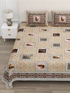 Close view of peacock patches and the brown ornamental border on the beige bedsheet