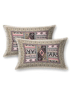 Two pillow covers with a sand beige geometric border and beige & pink Aztec patchwork centre