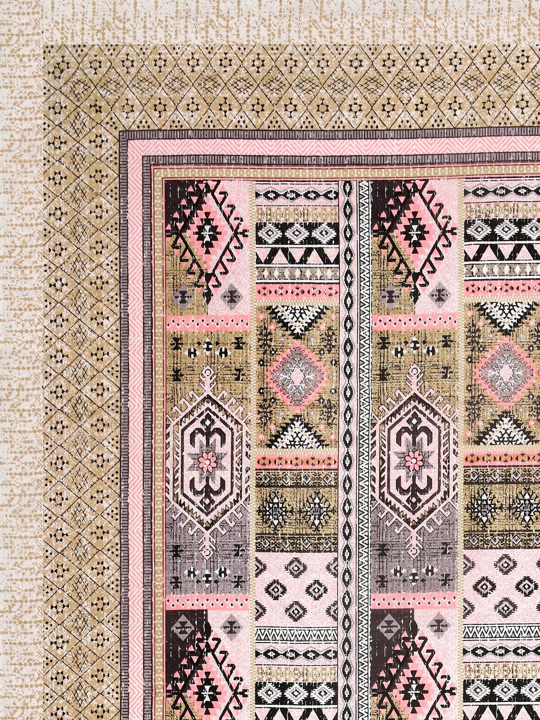 Corner close-up of blush pink, mauve, dark brown and black kilim-style panels and the sand beige geometric border