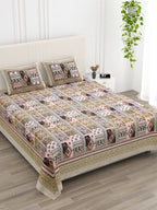 Angled view of the beige & pink Aztec patchwork bedsheet on a bed with 2 pillow covers
