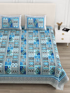 Close front view of the blue & grey geometric patchwork bedsheet and pillow covers