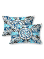 Two pillow covers with a blue, navy and grey paisley medallion and check ring