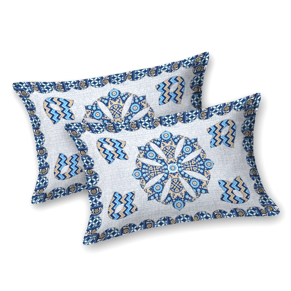 Two white pillow covers with a blue mandala medallion and blue and beige chevron motifs