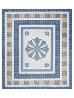 Full flat view of the blue and white bedsheet with central mandala medallion and layered borders