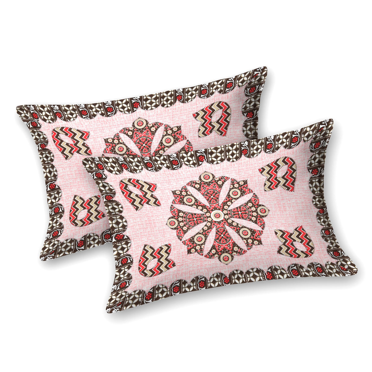 Two blush pink pillow covers with a brown and red mandala medallion and chevron motifs