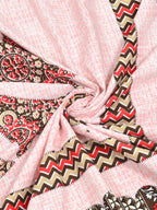 Swirled fabric close-up of red, brown and beige chevron print on a blush pink textured-look base