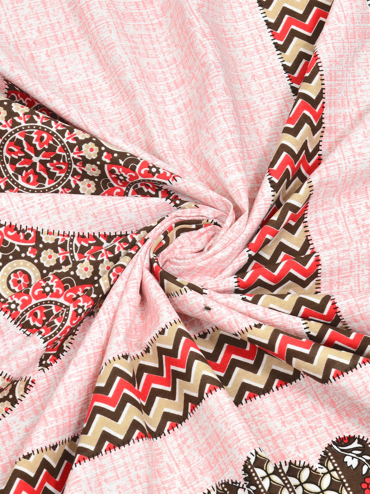 Swirled fabric close-up of red, brown and beige chevron print on a blush pink textured-look base
