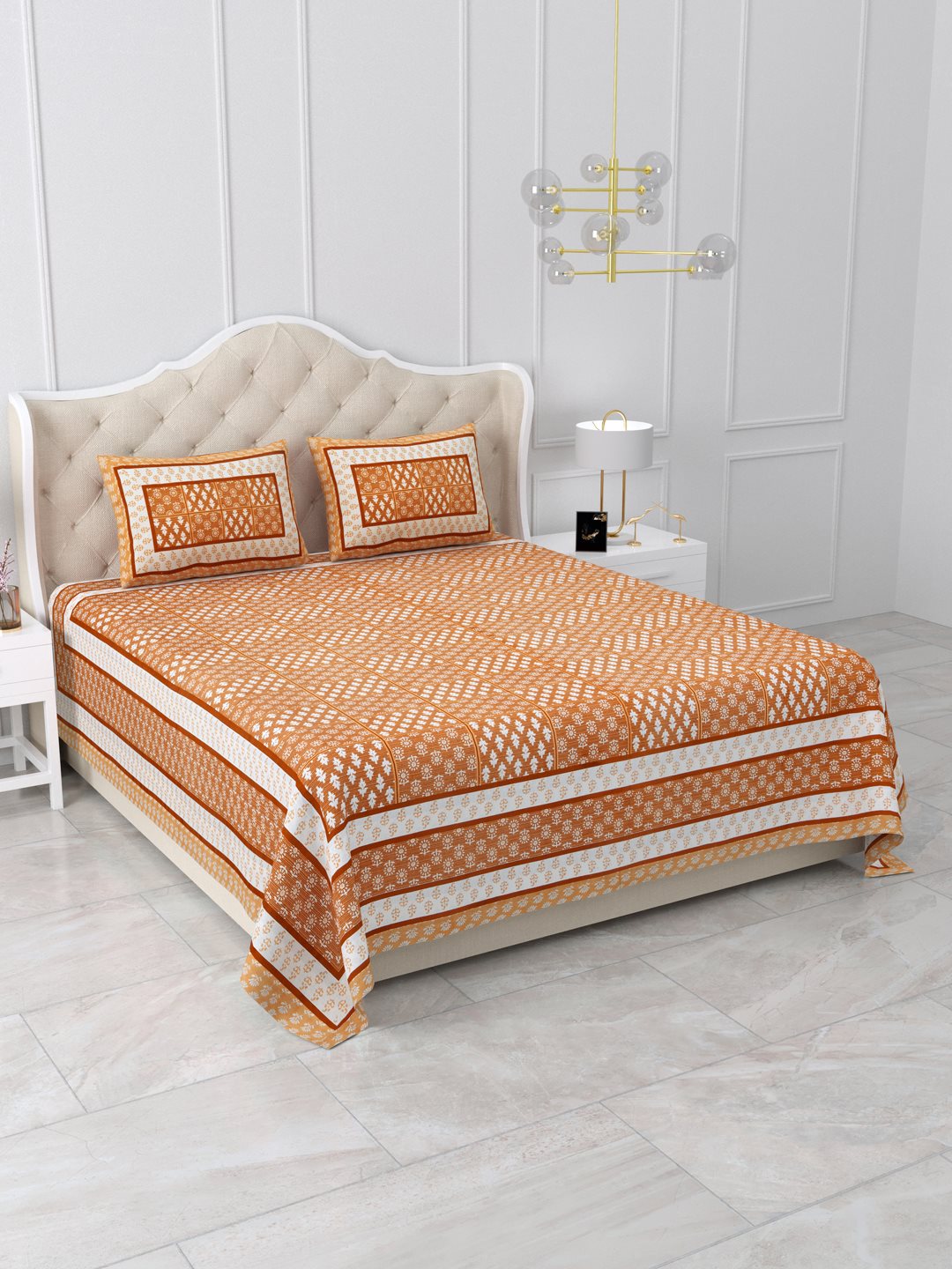 Angled view of the burnt orange and white buta grid bedsheet showing layered side borders