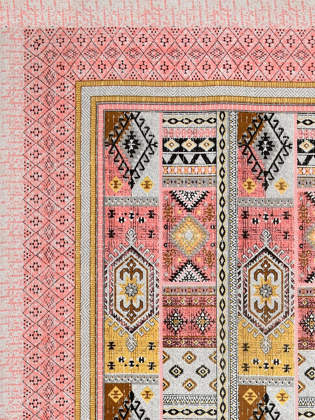 Corner close-up of mustard yellow, brown, grey and black kilim-style panels and the coral pink geometric border