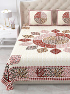 Close view of the maroon, rust and pink leaf mandala and border on the bed