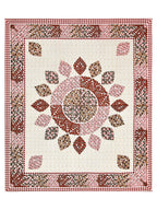Full flat view of the cream and maroon leaf mandala bedsheet with leaf-motif border