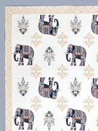 Close-up of decorated grey & beige elephants and beige floral butas on a white base
