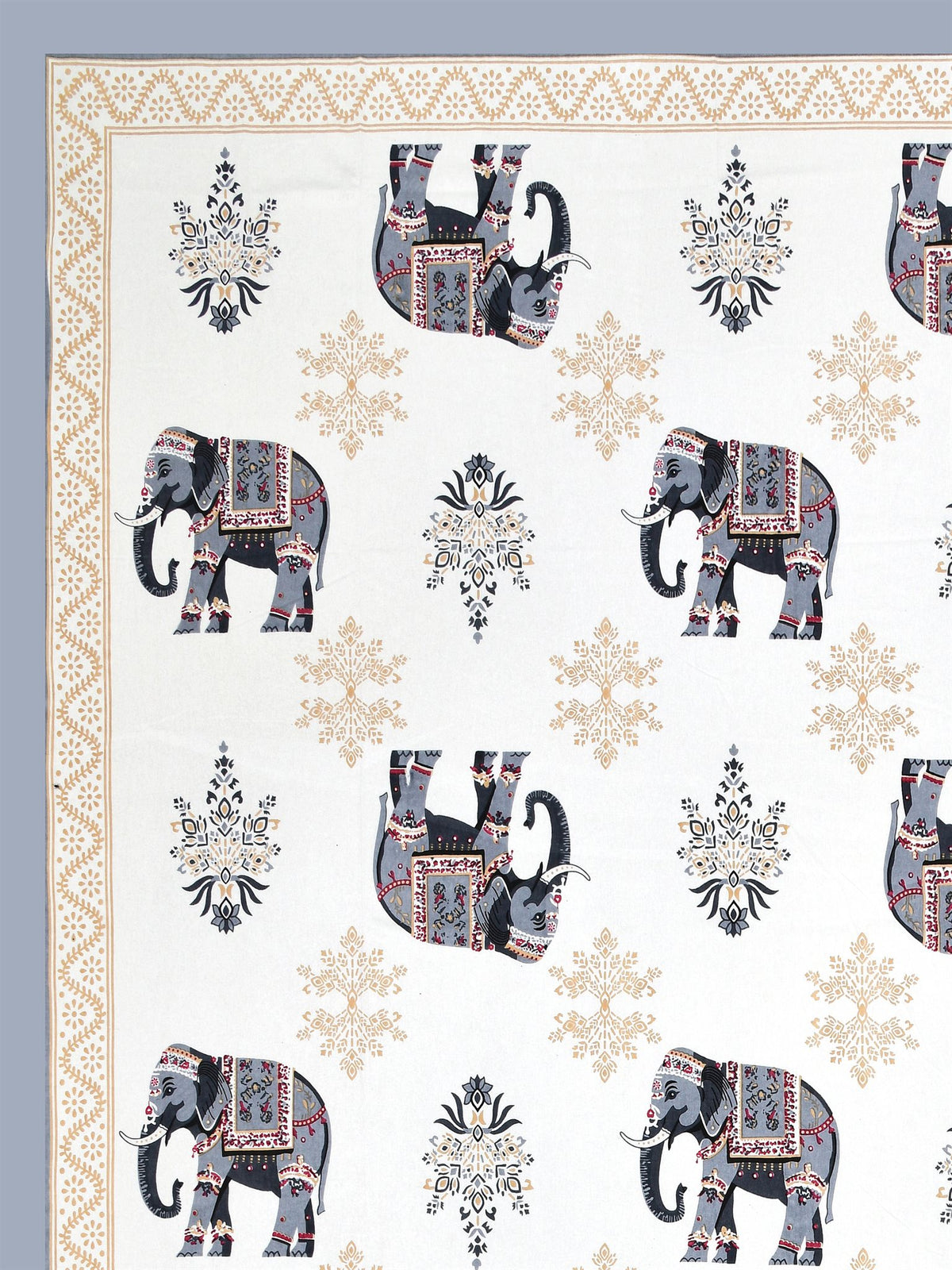 Close-up of decorated grey & beige elephants and beige floral butas on a white base
