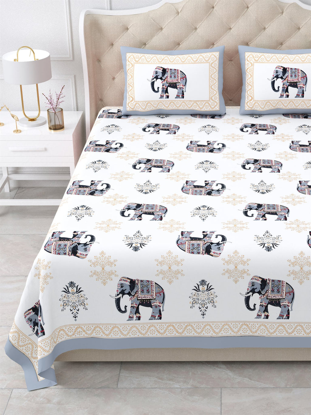 Close front view of the grey & beige elephant print bedsheet and framed pillow covers