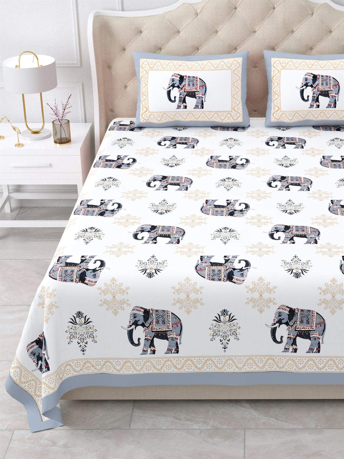 Close front view of the grey & beige elephant print bedsheet and framed pillow covers