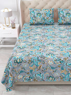 Close view of the grey and teal floral bedsheet and pillow covers on the bed