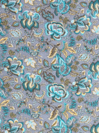 Close-up of large turquoise, teal and mustard Jacobean-style flowers on a cool grey base