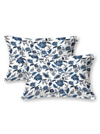 Two white pillow covers with indigo and navy trailing floral vine print