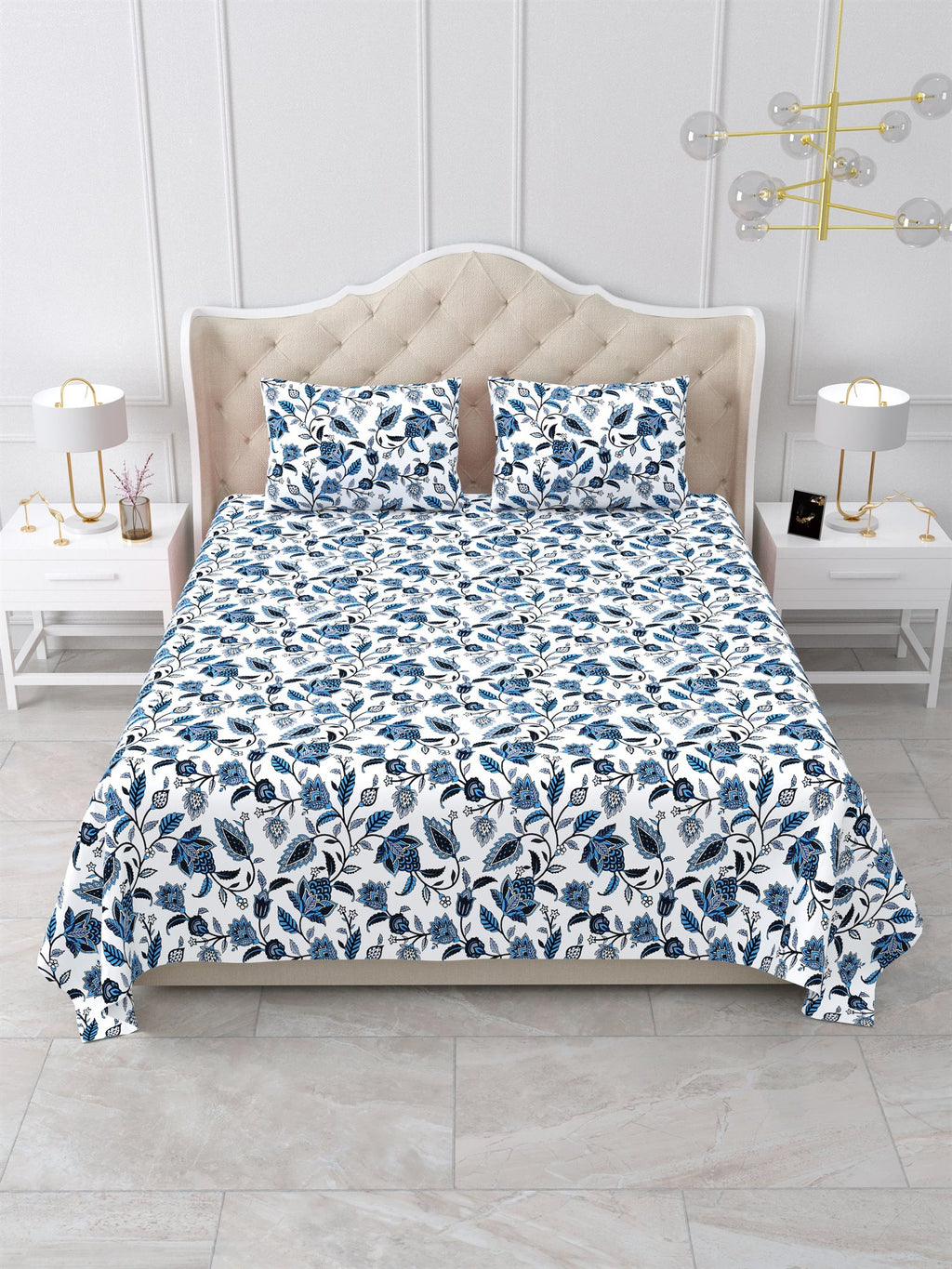 Front view of the indigo blue and white floral vine bedsheet on a bed with 2 matching pillow covers