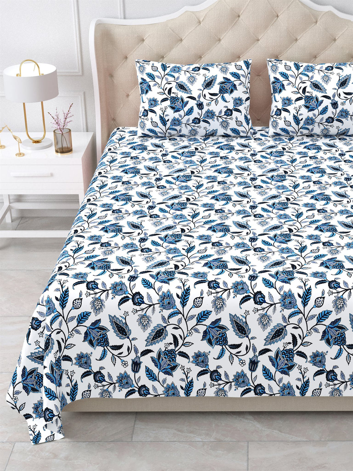 Close view of the indigo floral vine bedsheet and pillow covers on the bed