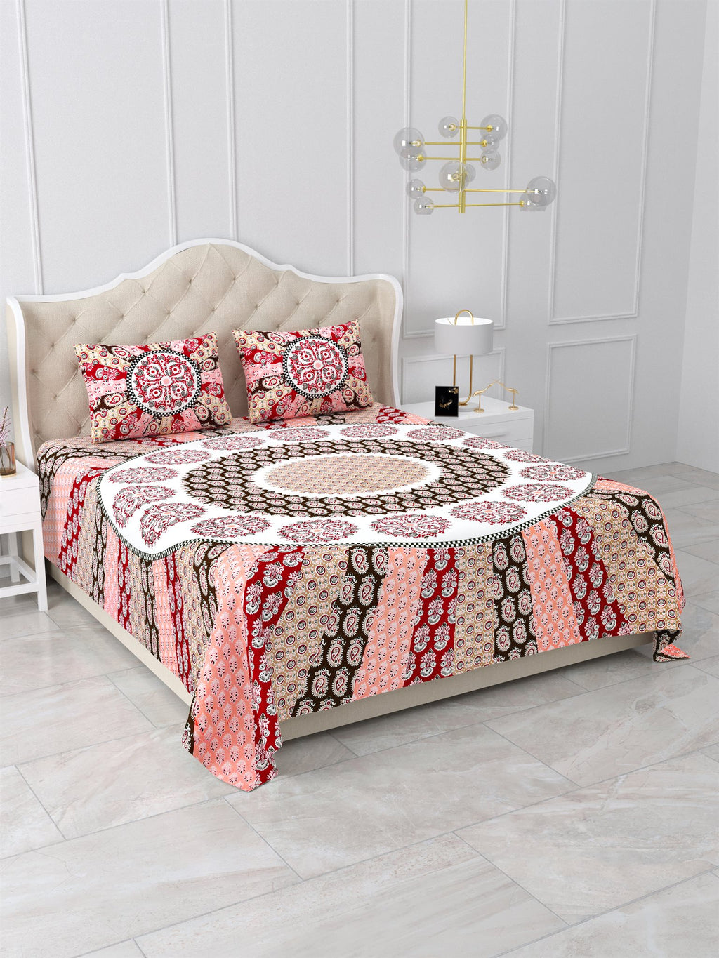 Angled view of the maroon and pink mandala king size bedsheet showing the sunburst rays on the side