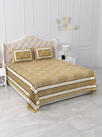 Angled view of the mustard and white buta grid bedsheet showing layered side borders