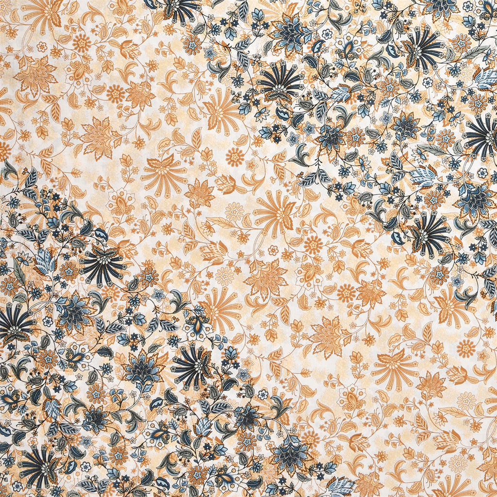 Close-up of the peach and navy-blue floral print where the diamond panel meets the cream border