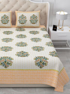 Close view of the bed with rows of olive and teal bouquet butas above the peach border