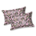 Two pink pillow covers with brown and grey Jacobean florals and a thin dark brown border line