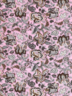 Close-up of large chocolate brown, grey and beige Jacobean-style flowers on a pink base