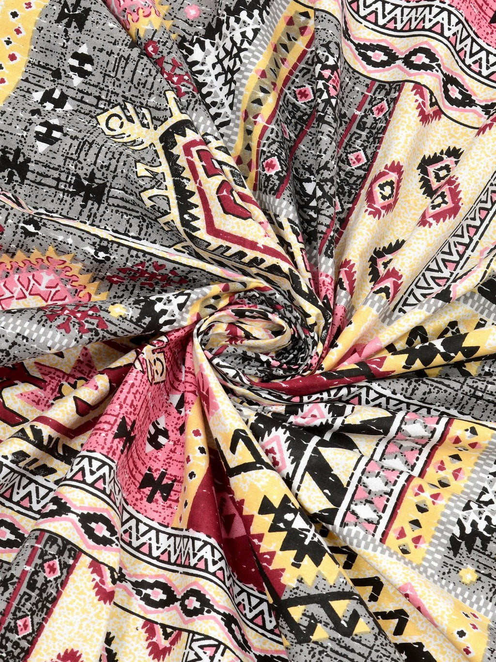 Swirled fabric close-up of pink & grey Aztec and kilim-style geometric print