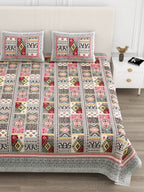 Close front view of the pink & grey geometric patchwork bedsheet and pillow covers