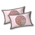 Two pink pillow covers with a maroon, caramel and grey quartered leaf medallion and triangle edge