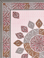Flat corner close-up of the leaf mandala and maroon leaf border on a pink lattice base