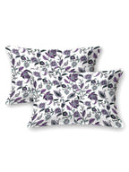 Two white pillow covers with purple, lavender and green trailing floral vine print