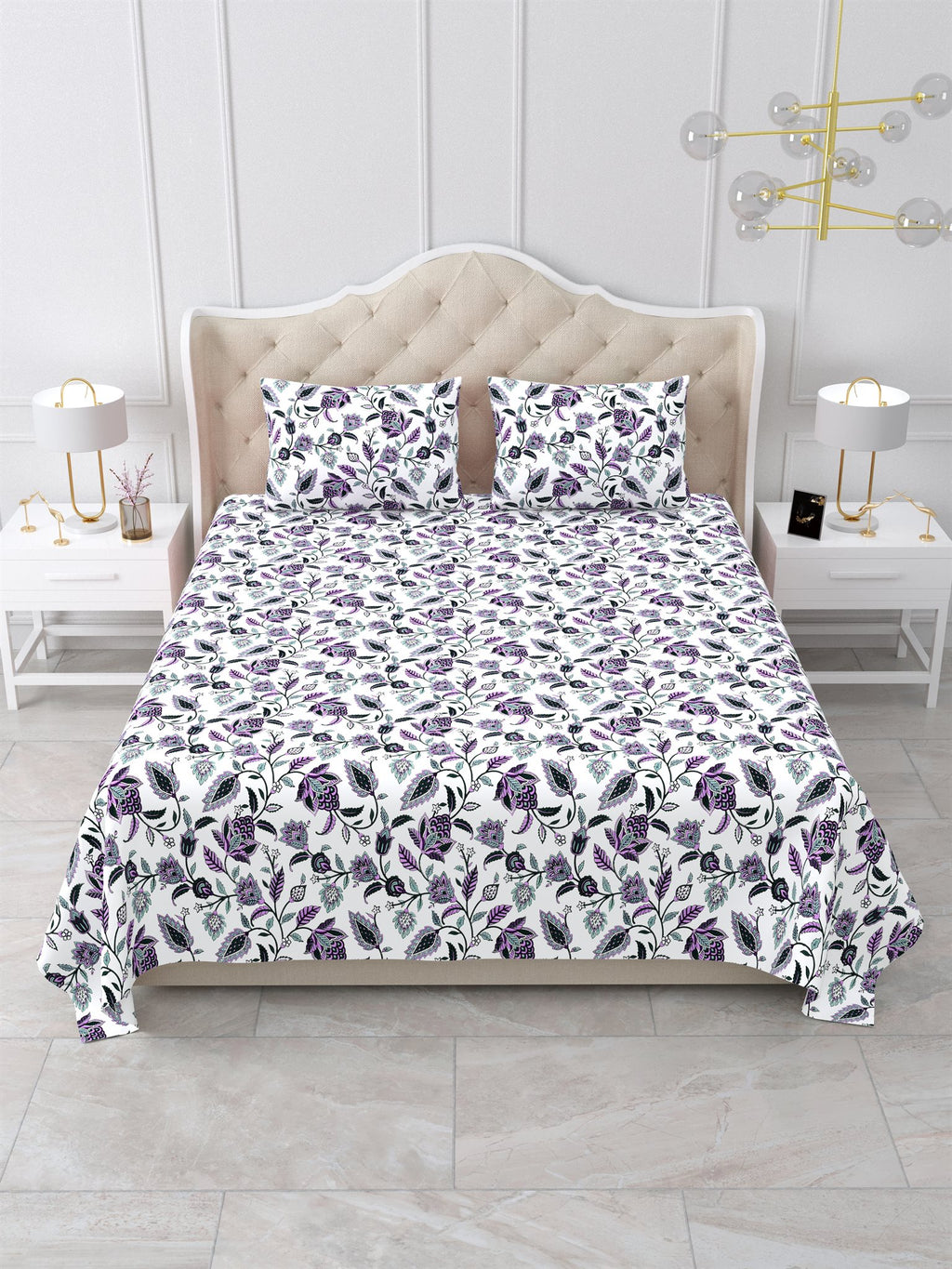 Front view of the purple and white floral vine bedsheet on a bed with 2 matching pillow covers