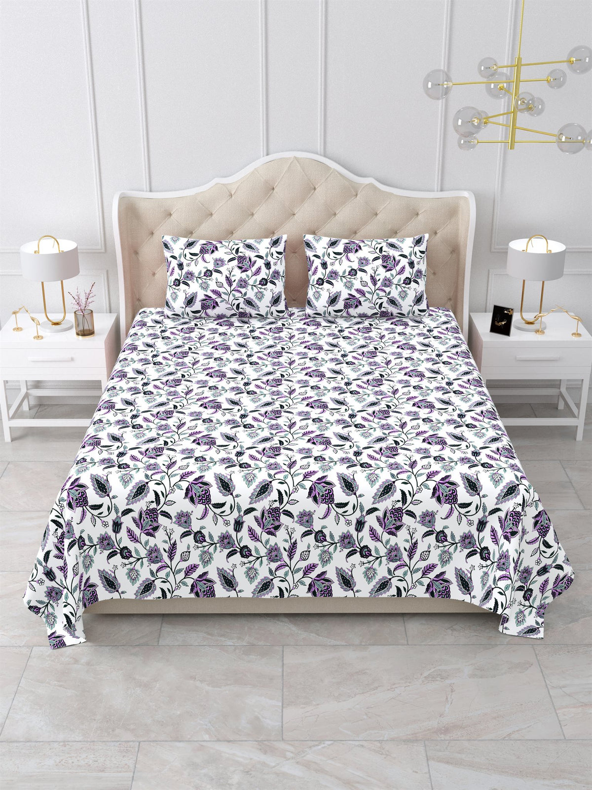 Front view of the purple and white floral vine bedsheet on a bed with 2 matching pillow covers