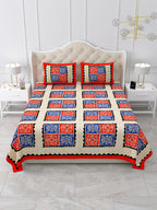 Front view of Castile India red and blue patchwork square bedsheet 90x108 on a bed with 2 pillow covers