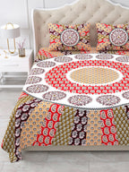 Close view of the round red mandala centre and peach and olive rays on the bed
