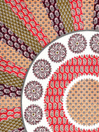 Close-up of the red mandala rings and peach, wine and olive paisley stripes