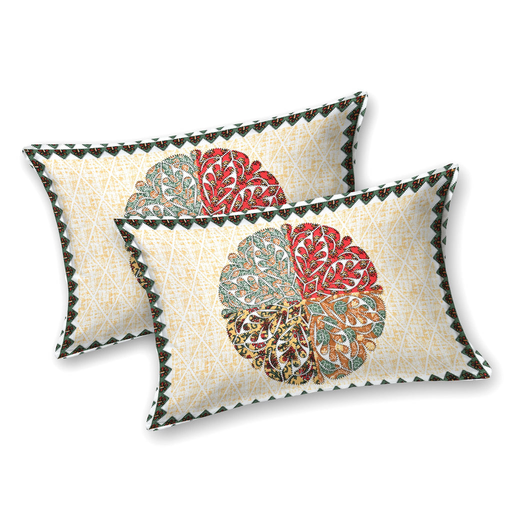 Two cream pillow covers with a red, sage and ochre quartered leaf medallion and triangle edge