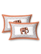 Two pillow covers with a rust orange frame and a single rust orange elephant motif in the centre