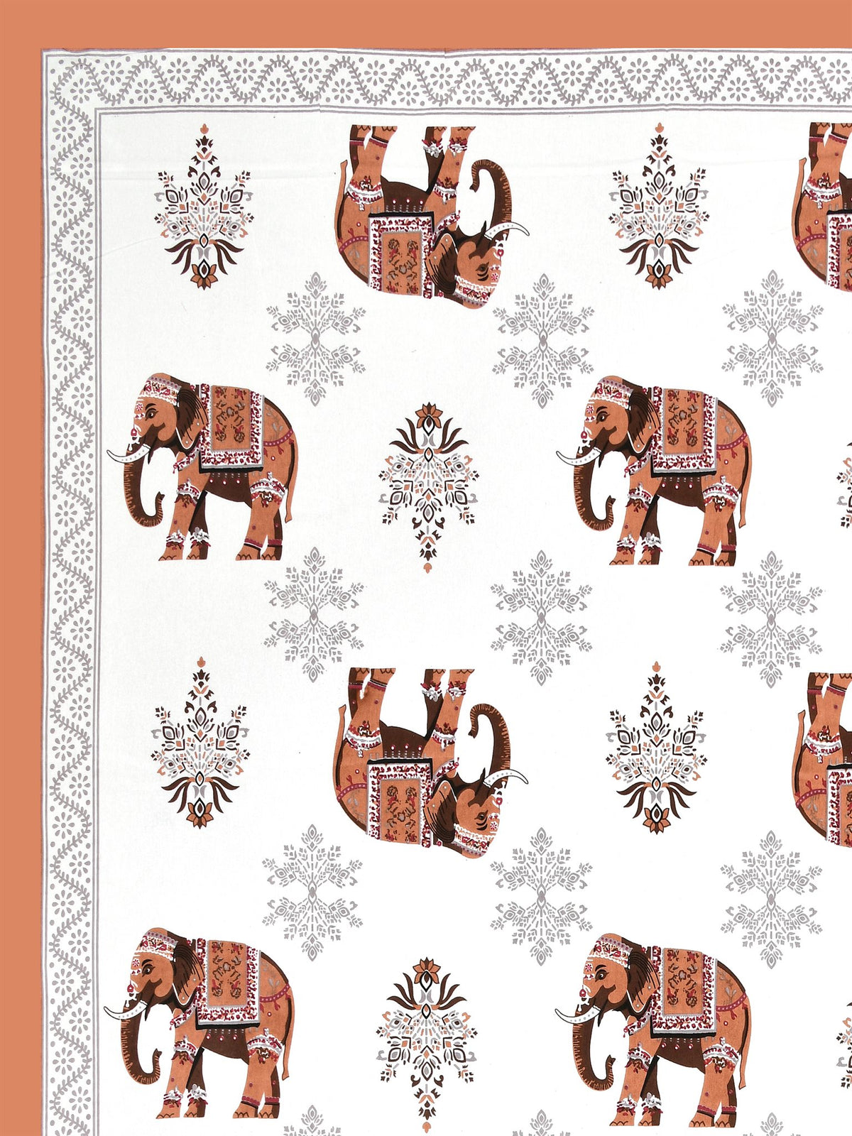 Close-up of decorated rust orange elephants and grey floral butas on a white base