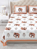Close front view of the rust orange elephant print bedsheet and framed pillow covers