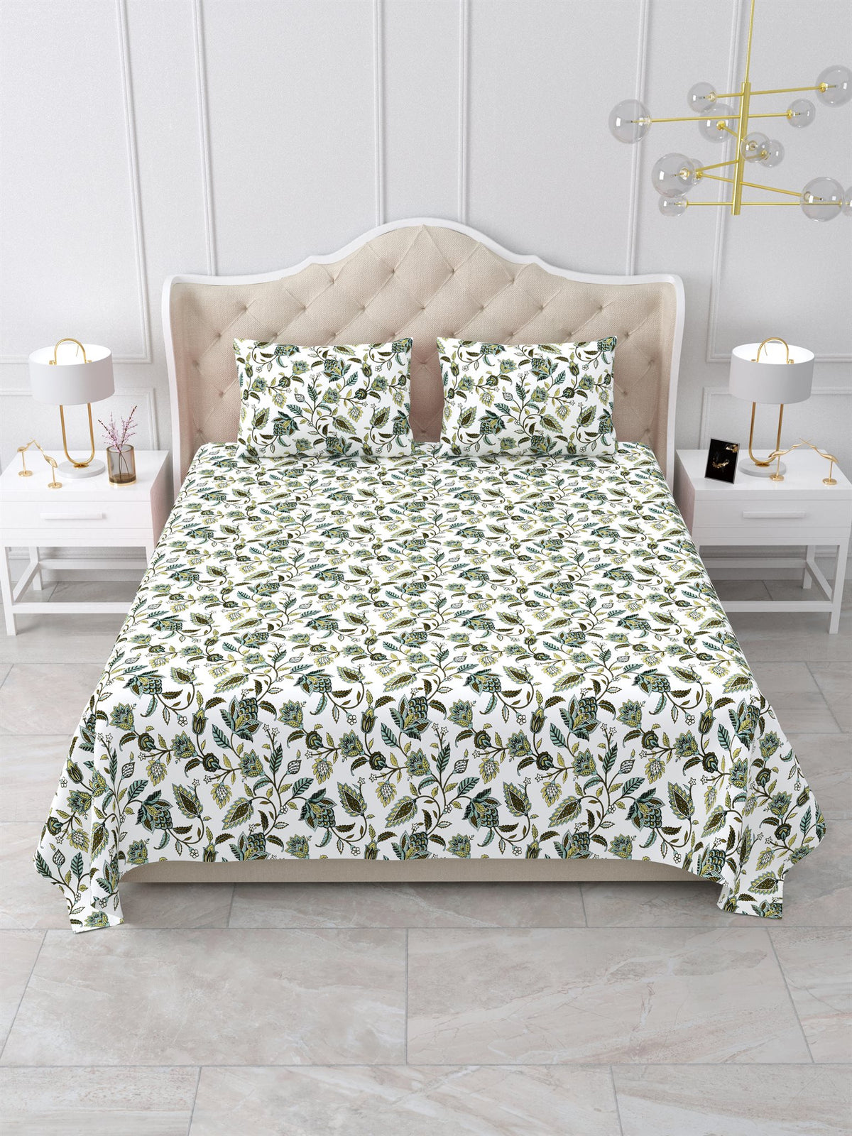 Front view of the sage green and white floral vine bedsheet on a bed with 2 matching pillow covers