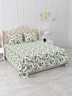 Angled view of the green floral vine bedsheet on a bed