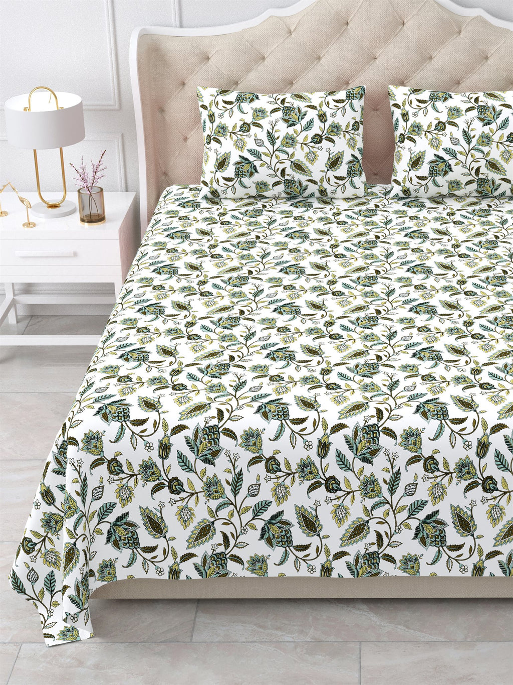 Close view of the olive and sage floral vine bedsheet and pillow covers on the bed