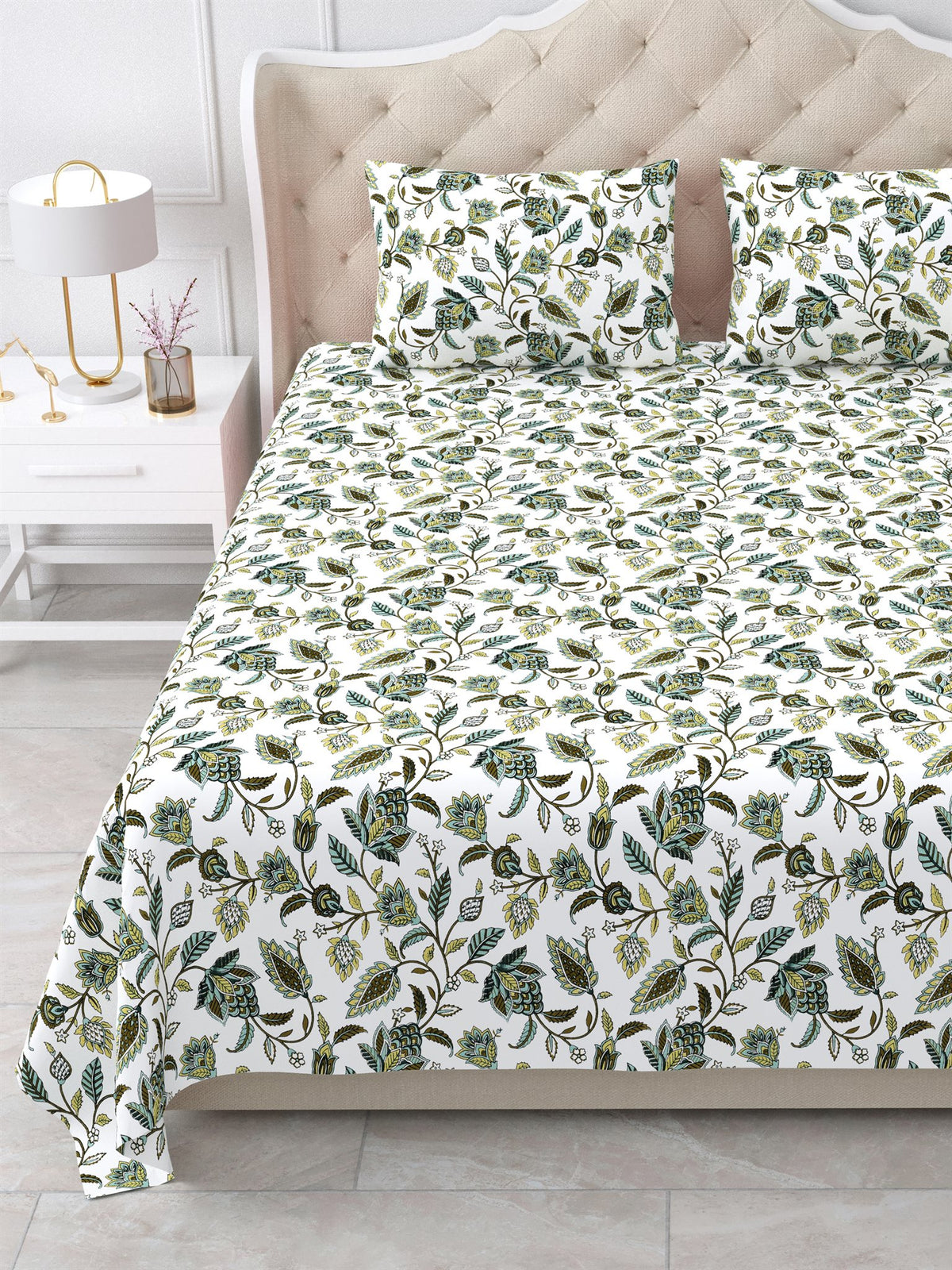 Close view of the olive and sage floral vine bedsheet and pillow covers on the bed